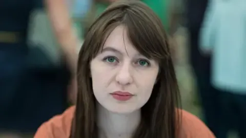 Sally Rooney declares she is unable to visit the UK because of potential arrest